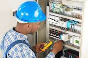 An electrician examines a fusebox. Sub-contractors are prone to  exploitation in the building industry, says Jantji Mahlangu.