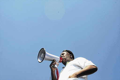 Expelled ANC Youth League president Julius Malema addresses mineworkers at the Gold Fields KDC Gold mine in Carletonville, west of Johannesburg, yesterday Picture: ANTONIO MUCHAVE .