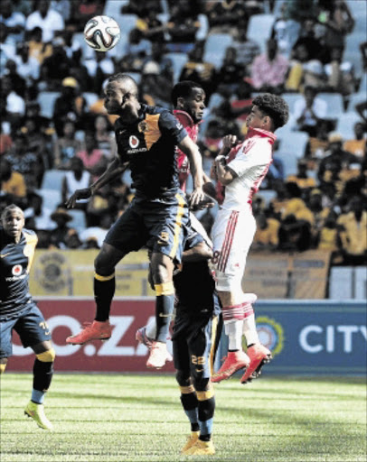 EYE ON THE BALL: Siboniso Gaxa of Kaizer Chiefs and Keegan Dolly of Ajax Cape Town during the match yesterdayPhoto: Gallo Images