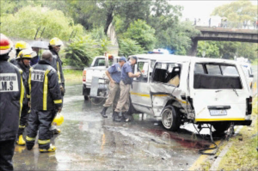 AFTERMATH: A minibus taxi collided with a Mazda 323 sedan in Barry Hertzog Avenue in Emmarentia, western Johannesburg.Pic. PETER MOGAKI. 25/02/2010. © Sowetan. 20100225PMO:Taxi lost control and collided with Mazda sedan at Berry Hertzog in Emarentia, west of Johannesburg.PHOTO:PETER MOGAKI