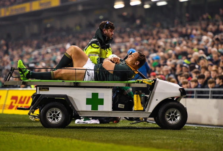 Coenie Oosthuizen of South Africa is stretchered from the field after an injury during the Castle Lager Outgoing Tour match against Ireland at Aviva Stadium on November 11, 2017 in Dublin, Ireland.