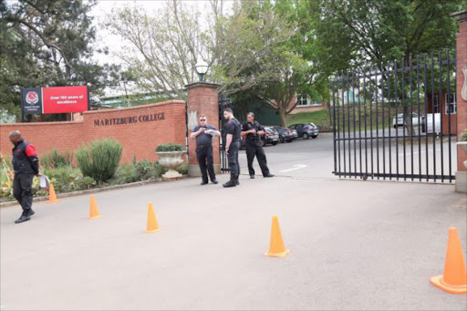 Security outside Maritzburg college this morning in anticipation of trouble after photos of matric pupils holding shirts in supports of EFF were seen on social media and caused a racial row. Picture JACKIE CLAUSEN