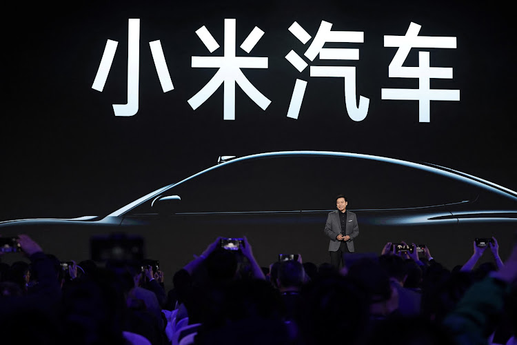 Xiaomi founder and CEO Lei Jun speaks at an event to introduce the company's first electric vehicle (EV) SU7, in Beijing, China.