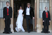 The newly married Duke and Duchess of Sussex, Meghan Markle and Prince Harry, leaving Windsor Castle after their wedding to attend an evening reception at Frogmore House, hosted by the Prince of Wales Windsor, Britain, May 19, 2018.