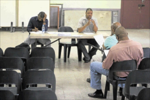 NO SHOW: Mogodi Masenya, right, from the Department of Labour, speaks during a poorly attended meeting in Johannesburg yesterday between the department and stakeholders in the taxi industry. Photo:VathiswaRuselo