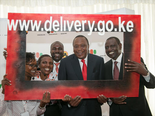 President Uhuru Kenyatta and DP William Ruto at launch of public information portal at KICC. /FILE