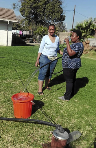 Neighbours Anna Matseke and Smangele Mahlangu rely on water from boreholes. /ISAAC MAHLANGU