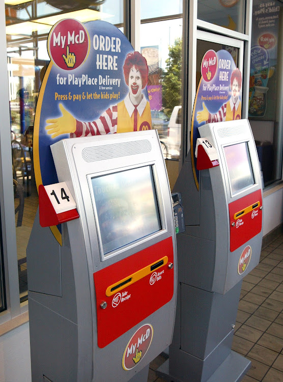 A computerized kiosks are seen in a play area inside a McDonald's restaurant in St. Charles, Illinois. McDonalds introduced the kiosks to cut labour costs and shorten lines for consumers. Picture: TIM BOYLE/GETTY IMAGES/FILE