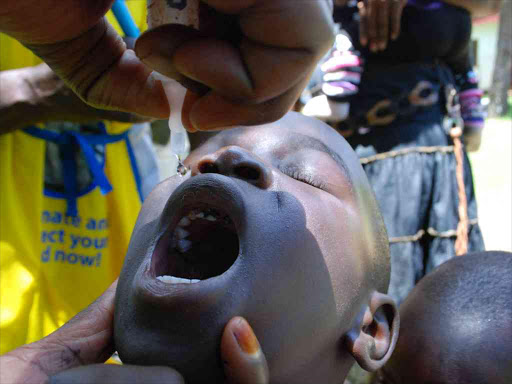 A minor receives a polio vaccine at a Kisii Level Five hospital on April 10,2017./FILE