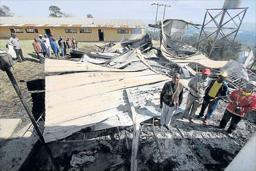 LITTLE LEFT: A home economics classroom at the Chief Henry Bokleni High School, in Ntlaza near Libode, was burnt down on Wednesday with all kitchen items, documents and school groceries still inside. A villager rushed to the scene and doused the fire before it could spread to other classrooms. There was also an attempt to set alight the principal’s office and the administration block Picture: LULAMILE FENI