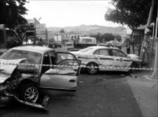 COLLISION: The wrecks of a police patrol vehicle and a civilian car. The police car was apparently chasing after criminals when it collided with the civilian car in Nelspruit on Sunday. Pic. Riot Hlatshwayo. 12/05/08. © Sowetan.