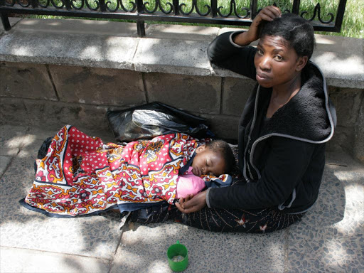 A street beggar with her child along Harambee Avenue, Nairobi. /FILE