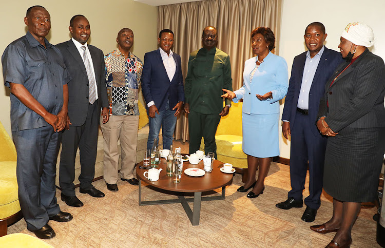 ODM leader Raila Odinga (centre) with Ukambani leaders led by the three governors: Kitui’s Charity Ngilu (third right), Machakos' Alfred Mutua (fifth right), Makueni’s Kivutha Kibwana (third left) and other grassroots leaders at a Nairobi hotel on November 10.