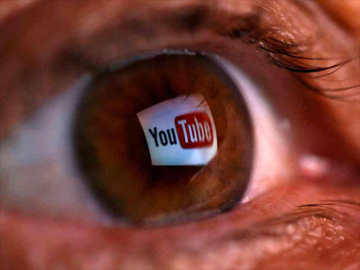 A picture illustration shows a YouTube logo reflected in a person's eye June 18, 2014. REUTERS/Dado Ruvic/File Photo