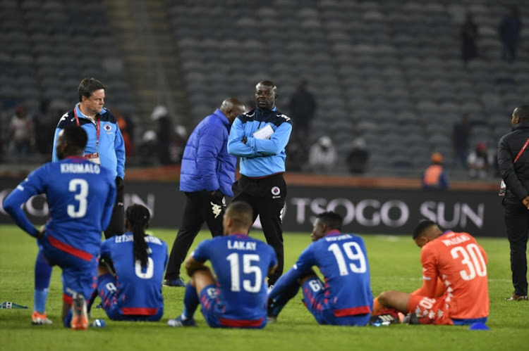 SuperSport United coach Kaitano Tembo and players during the Absa Premiership match between Orlando Pirates and SuperSport United at Orlando Stadium on September 15, 2018 in Johannesburg, South Africa.