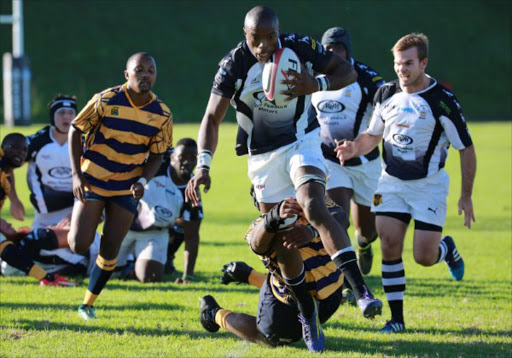APRIL 23, 2017 Siya November from Old Boys breaks throught the Police defence to score a try during a clash at Old Boys Club over the weekend PICTURE ALAN EASON