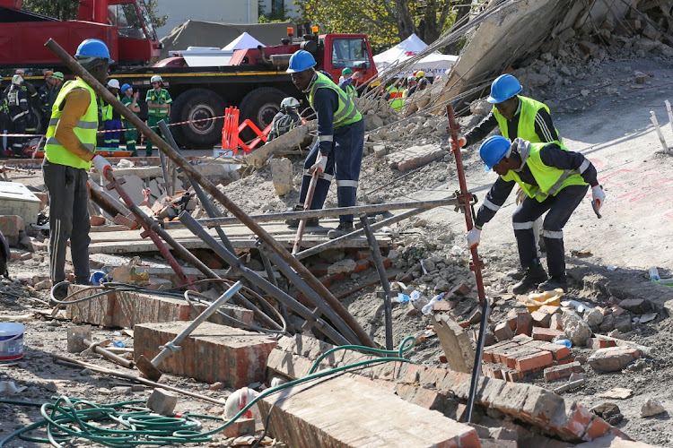 Rescue workers continued to scour the rubble of the collapsed building in Victoria Street on Wednesday, trying to recover workers presumed trapped in the debris. About 75 construction workers were on site when the building collapsed at about 2pm on Monday.