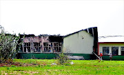 BURNT OUT: The blackened  Noto High School in Kopela, North West,  became a casualty of angry residents who torched it during a protest on Tuesday  Photo: Tiro Ramatlhatse