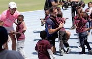Rafael Nadal, left, and Roger Federer with children from Hangberg  Pre-Primary School in Hout Bay at a 'learning through play' session at Green Point Athletics Stadium in Cape Town on February 7 2020.