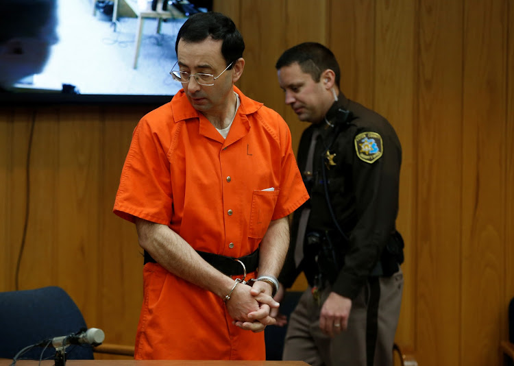 Larry Nassar, a former team USA Gymnastics doctor who pleaded guilty in November 2017 to sexual assault charges, stands in court during his sentencing hearing in the Eaton County Court in Charlotte, Michigan, US.