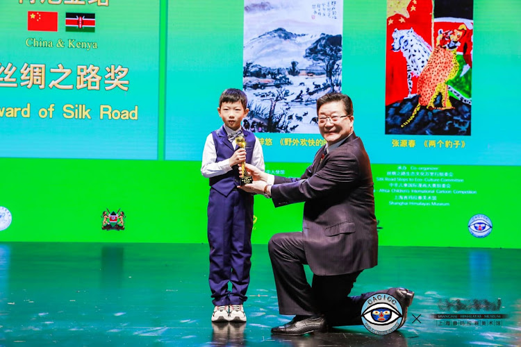 China Africa Peace Foundation chairman Zhang Ming awards a participant of the China-Africa Children International Competition in Shanghai on Tuesday, January 23, 2024