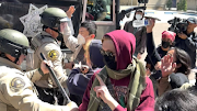 Law enforcement officers clash with students during a protest at UC San Diego, during the ongoing conflict between Israel and the Palestinian Islamist group Hamas, in San Diego, California, US, May 6, 2024, in this screen grab obtained from a social media video.  