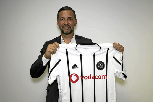 New Orlando Pirates head coach Josef Zinnbauer from Germany, poses with the club's home jersey. / Orlando Pirates website