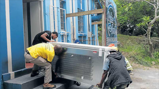 CONFISCATED: Members of the public allegedly helped government officials remove a freezer full of 272 crayfish from the Waterfront Restaurant in Port St Johns despite it being legally bought from a company that has a permit to buy from Wild Coast subsistence fishermen Picture: SUPPLIED