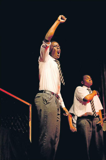 POWERFUL PERFORMANCES: Sikhu Dliwayo, left, and Juta Makupula form part of the cast of 16 Selborne College Dramatic Arts Society pupils performing ‘Tableaux in Red: Oil on Canvas, 1976’ at the National Arts Festival in Grahamstown, which starts next week Picture: SUPPLIED