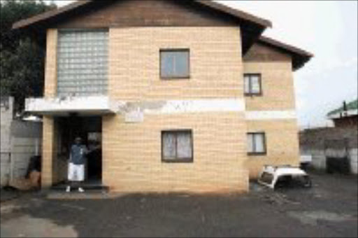 BUILDING STALLED: Alfa Mhlauli has not received payment for the flats he sold in Booysens, Johannesburg. Pic. Mohau Mofokeng. 27/03/07. © Sowetan.