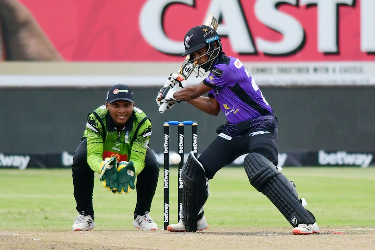 Dolphins batsman Keegan Peterson plays to the offside as Warriors wicketkeeper and captain Sinethemba Qeshile keeps a close watch