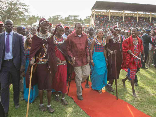 President Uhuru Kenyatta is welcomed at the Narok Stadium on arrival to address a public rally in Narok Town on April 7,2017.Photo PSCU