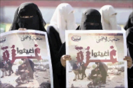 ENOUGH: Women take part in an anti-Israeli protest in Sanaa yesterday. The poster say: 'Relieve Gaza'. 29/12/2008. Pic. Khaled Abdullah. © Reuters.