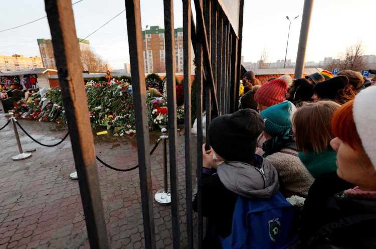 People gather in front of a closed entrance to the Borisovskoye cemetery as they come to the grave of Russian opposition politician Alexei Navalny the day after his funeral in Moscow, Russia, March 2 2024. Picture: REUTERS/STRINGER