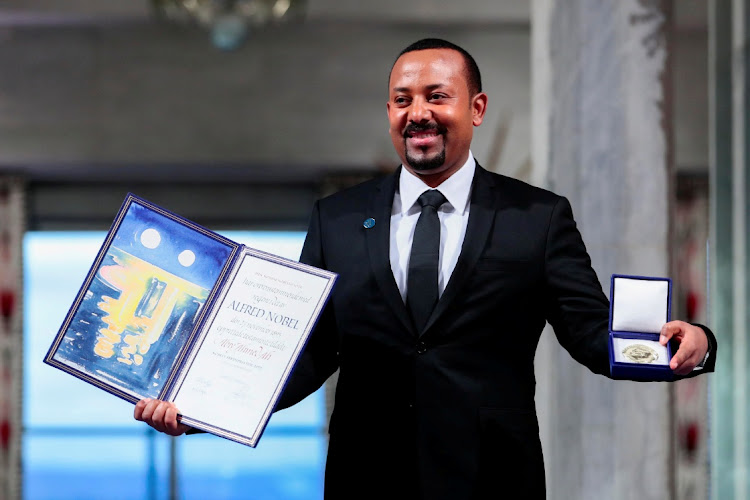 Ethiopian Prime Minister Abiy Ahmed Ali poses with medal and diploma after receiving Nobel Peace Prize during ceremony in Oslo City Hall, Norway December 10, 2019.