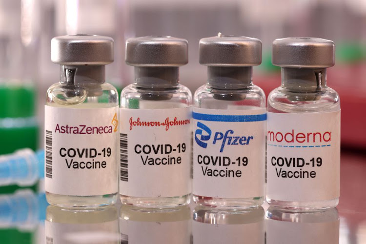 Vials labelled "AstraZeneca, Johnson & Johnson, Pfizer, Moderna COVID-19 Vaccine" are seen in this illustration taken January 16, 2022.