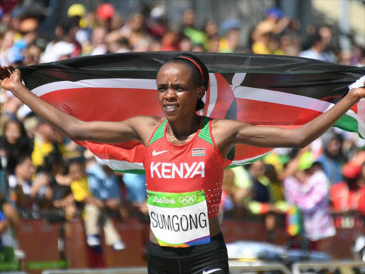 Jemima Sumgong (KEN) of Kenya celebrates after winning the 2016 Rio Olympics Women's Marathon in Rio de Janeiro, Brazil on August 14, 2016. /REUTERS