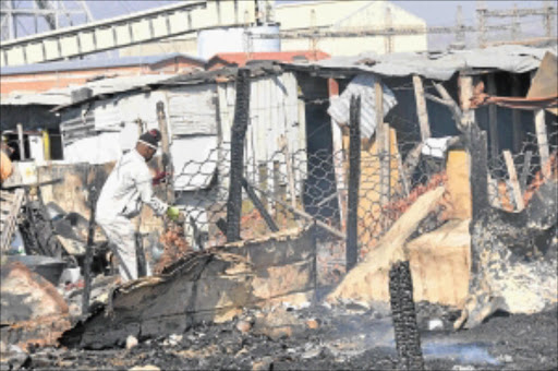 HOMES LOST: Burnt shacks in the Sondela Jabula informal settlement near Rustenburg in North West. Photo: Andrew Mahlaba