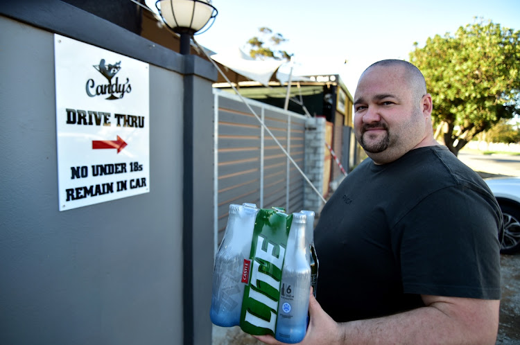 Candy’s owner Charl Muller at the new entrance to the Heugh Road club which allows for liquor or coffee purchases on one side, and the special drive-through adult show and liquor delivery to customers’ cars on the other.
