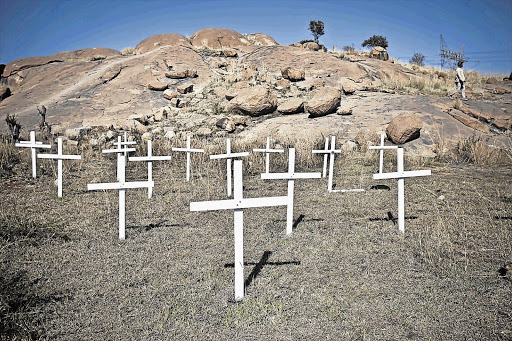 Crosses are seen on Wonderkop near the Nkaneng informal settlement in Marikana for the 34 miners who were shot dead by the police on August 16 last year