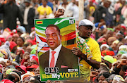 Supporters wait for Zim president Emmerson Mnangagwa to address an election rally.File photo.