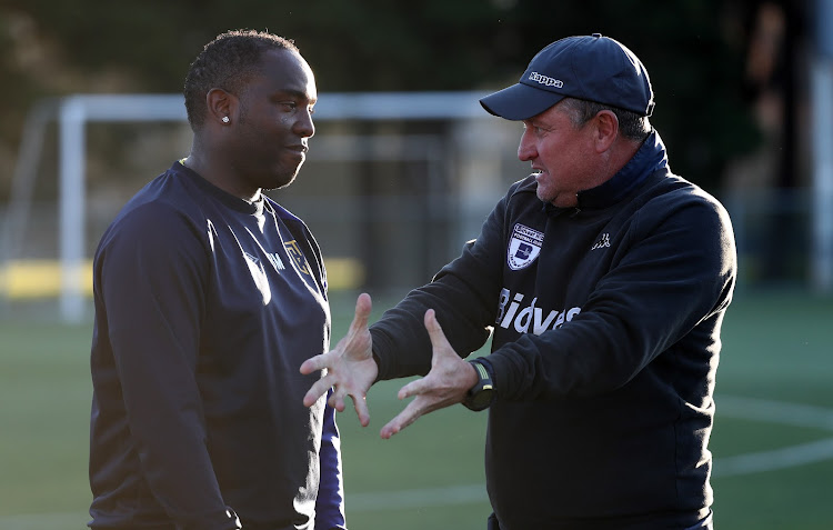 Cape Town City head coach Benni McCarthy (L) chats with Bidvest Wits coach Gavin Hunt (R), the coach that launched his playing career, during the pre season friendly match between the two clubs at Goldfields, Stellenbosch on 14 July 2017.