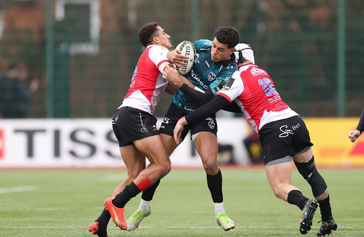 Rio Dyer of Dragons takes on Jordan Hendrikse of Emirates Lions and Henco van Wyk of Emirates Lions during the EPCR Challenge Cup match between Dragons and Lions at Sporting Excellence in Ystrad Mynach, Wales, January 22 2023. Picture: GARETH EVERETT/GALLO IMAGES