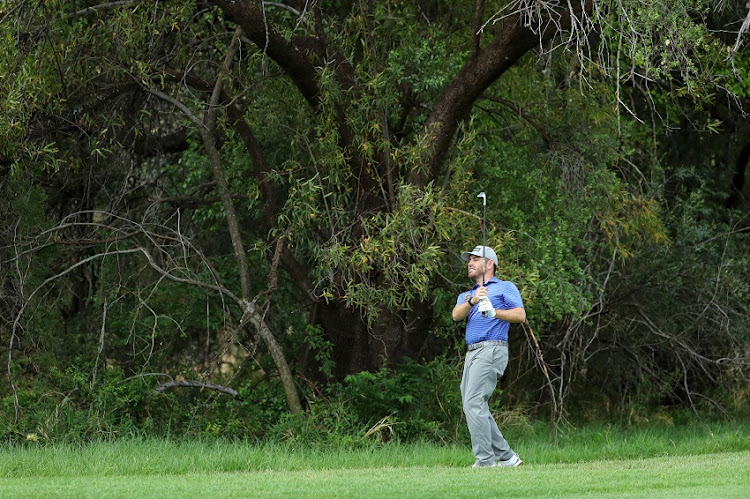 Louis Oosthuizen of South Africa chips on to the 14th green during day one of the Nedbank Golf Challenge hosted by Gary Player at Gary Player Golf Course on November 14, 2019 in Sun City, South Africa.