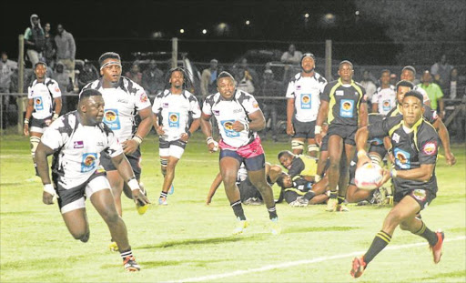 CHARGED UP: The Fort Hare Blues on attack as the Walter Sisulu University All Blacks defence closes in during the FNB Varsity Shield match at Davidson stadium in Alice on Thursday night Picture: SUPPLIED