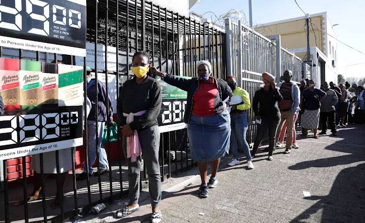 People queue for liquor in Nyanga, Cape Town.