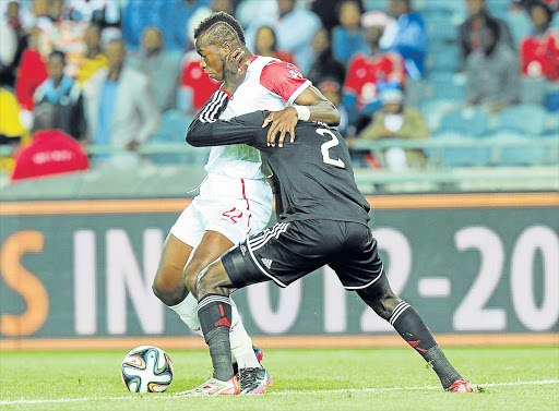 KEEPING A TIGHT GRIP: Camaldine Abraw, left, is seen here in Free State Stars colours battling for the ball with Ayanda Gcaba of Pirates in a Premier League match last October. Abraw’s transfer is at the centre of controversy between Chiefs and Bloemfontein Celtic Picture: GALLO IMAGES