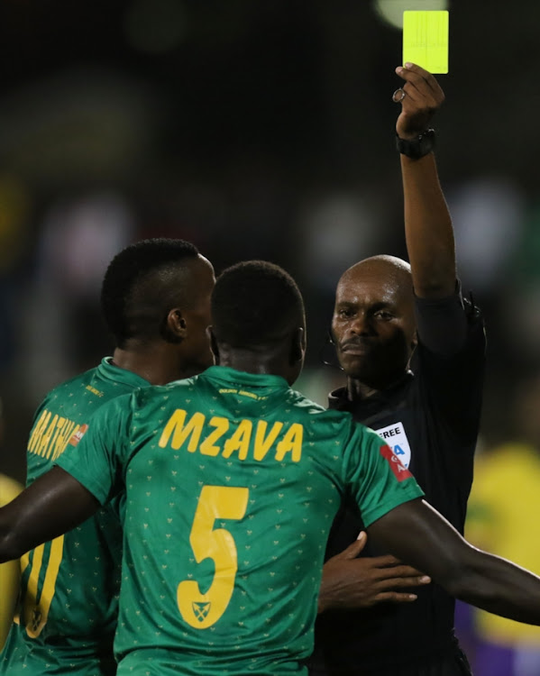 Referee Thando Ndzandzeka erroneously issues out a second yellow card to Lamontville Golden Arrows defender Limbikani Mzava during the Absa Premiership match against Orlando Pirates at Princess Magogo Stadium on March 17, 2018 in Durban, South Africa.