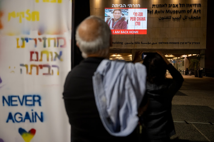 The face of the newly released hostage, Peri Chana, 79, is projected onto the wall outside The Museum of Modern Art known as the 'The Hostages and Missing Square', in Tel Aviv, Israel, November 24 2023. Picture: ALEXI ROSENFELD/GETTY IMAGES