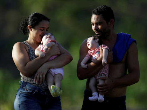 A Brazilian couple with their 10 months-old babies and both born with microcephaly, in Areia, Paraiba state, Brazil, February 8, 2017. /REUTERS